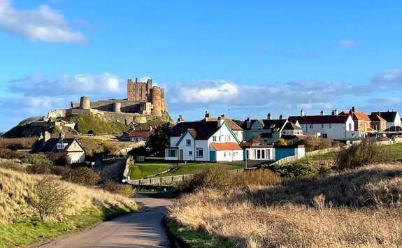 Northumberland blue skies and castle in the distance